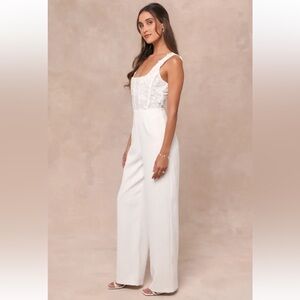 Lulu’s Truly Profound White Mesh 3D Floral
Embroidered Bustier Jumpsuit